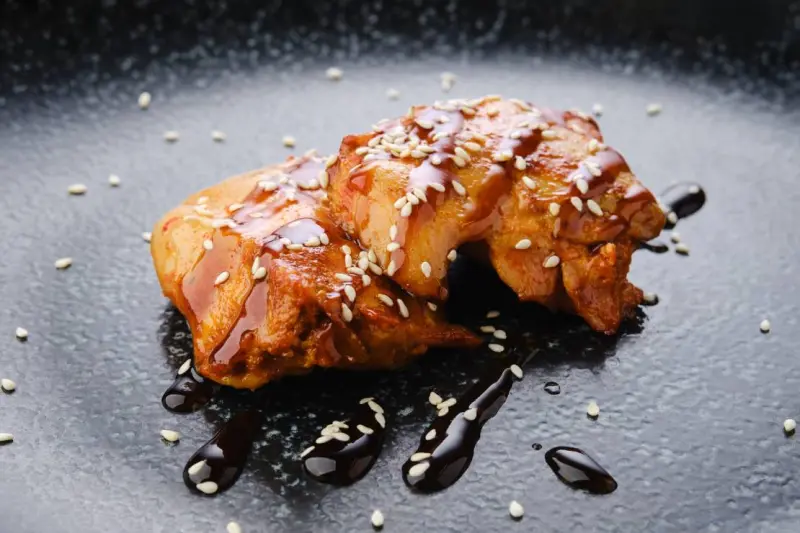 fried chicken meat with teriyaki sauce closeup